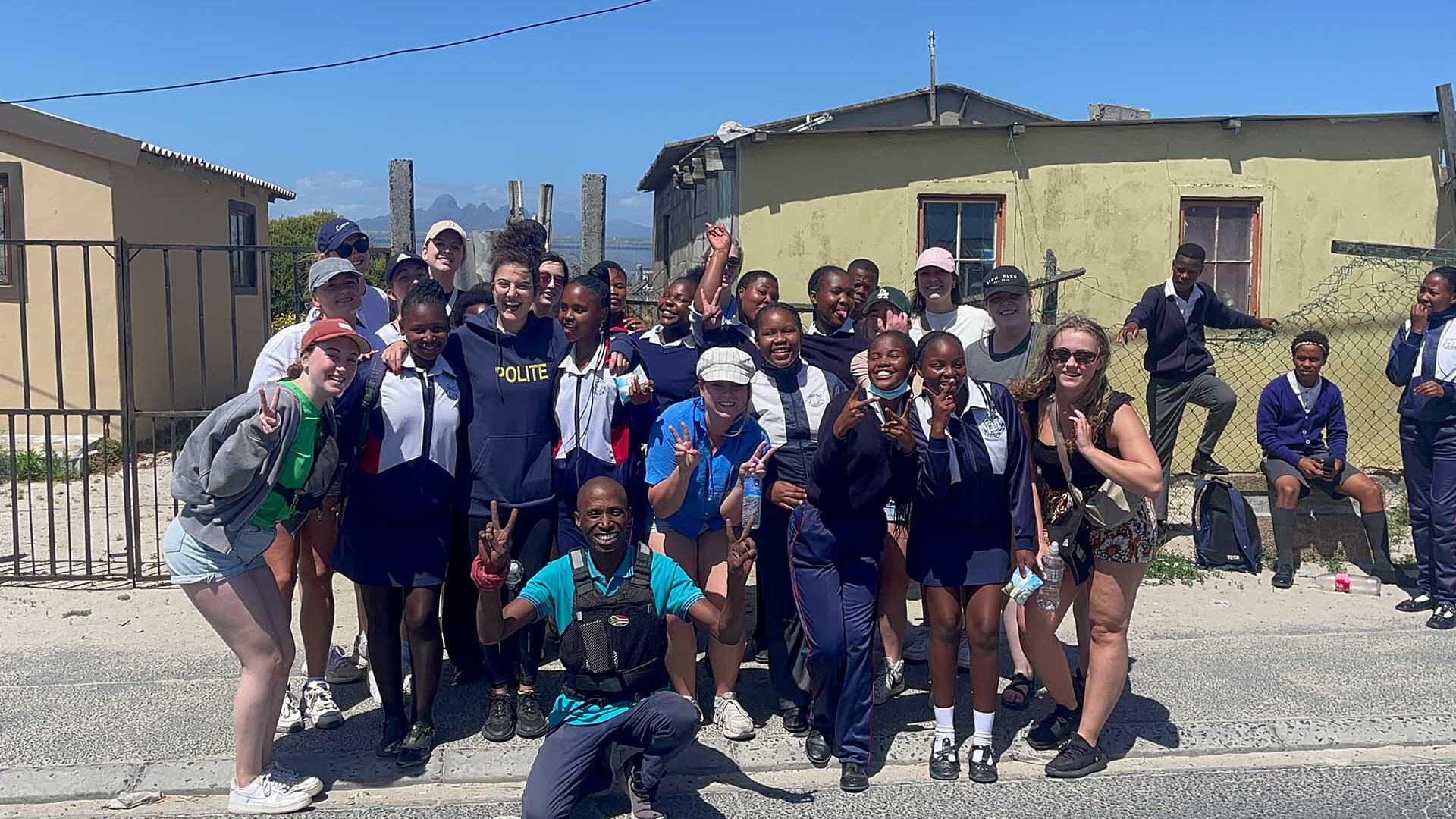 A group photo of tourists and locals in Khayelitsha