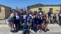 A group photo of tourists and locals in Khayelitsha